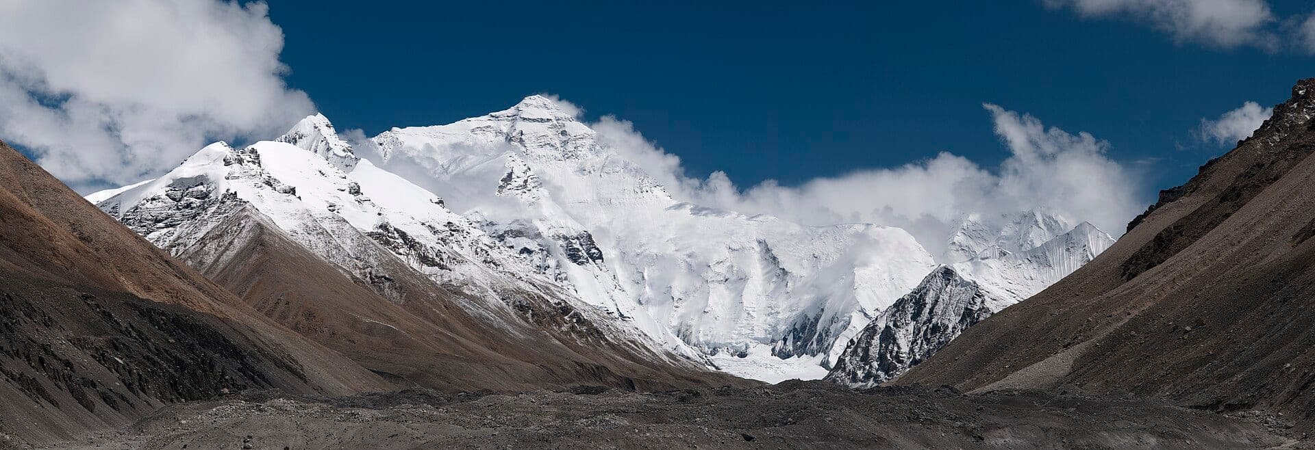 The north face of Mount Everest above a high valley in Tibet